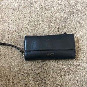 Black leather tri-fold Fossil wallet